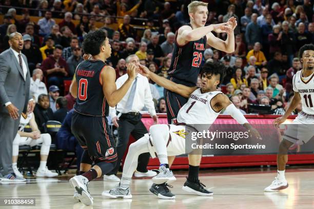 Utah Utes guard Sedrick Barefield knocks down Arizona State Sun Devils guard Remy Martin during the college basketball game between the Utah Utes and...