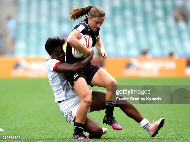 Michaela Blyde of New Zealand is tackled in the match against the USA during day one of the 2018 Sydney Sevens at Allianz Stadium on January 26, 2018...