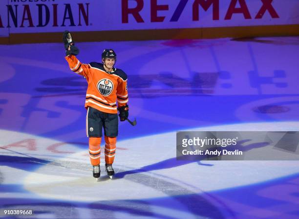 Brandon Davidson of the Edmonton Oilers salutes the crowed after begin selected the first star of the game against the Calgary Flames on January 25,...