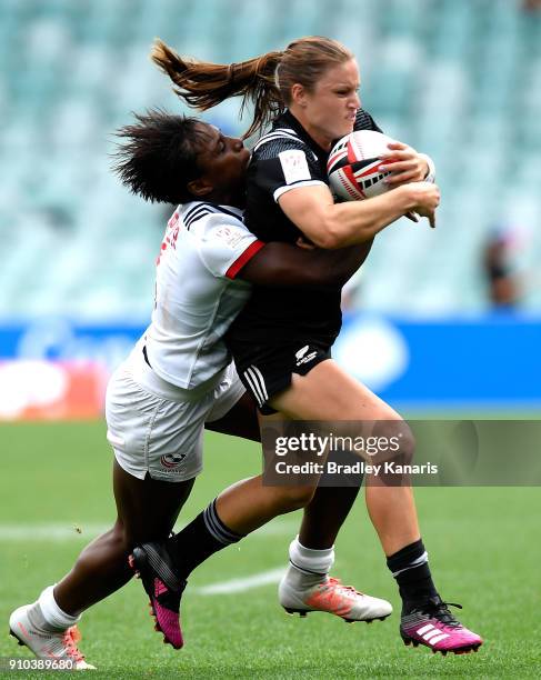 Michaela Blyde of New Zealand is tackled in the match against the USA during day one of the 2018 Sydney Sevens at Allianz Stadium on January 26, 2018...