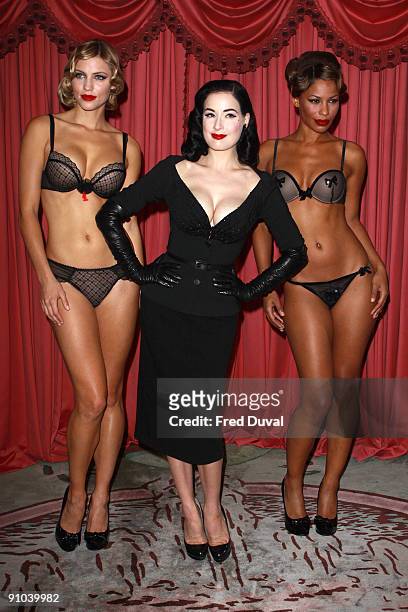 Dita Von Teese with models Amanda and Yazzy attends photocall to launch her new design for Wonderbra - The Party Edition at The Dorchester on...