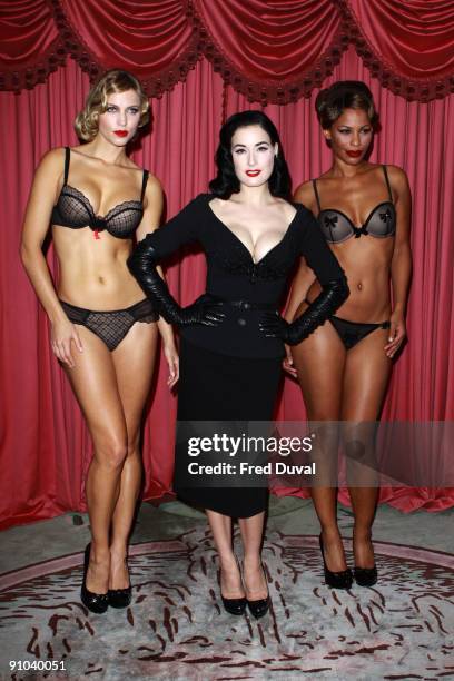 Dita Von Teese with models Amanda and Yazzy attends photocall to launch her new design for Wonderbra - The Party Edition at The Dorchester on...