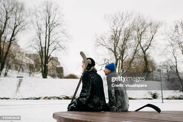 after winter hockey match - outdoor ice hockey stock pictures, royalty-free photos & images