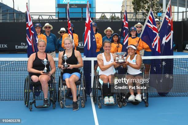 Aniek Van Koot of the Netherlands and Diede De Groot of the Netherlands pose for a photo with their runners-up trophy and Marjolein Buis of the...