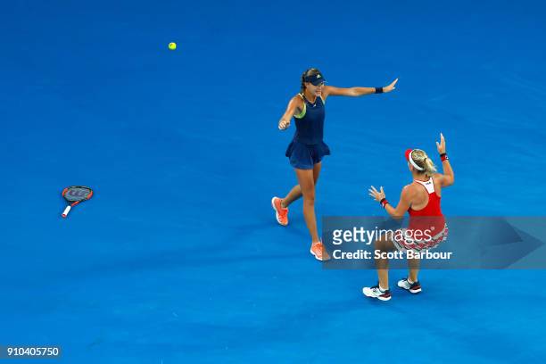 Kristina Mladenovic of France and Timea Babos of Hungary celebrate after winning the women's doubles final against Ekaterina Makarova of Russia and...