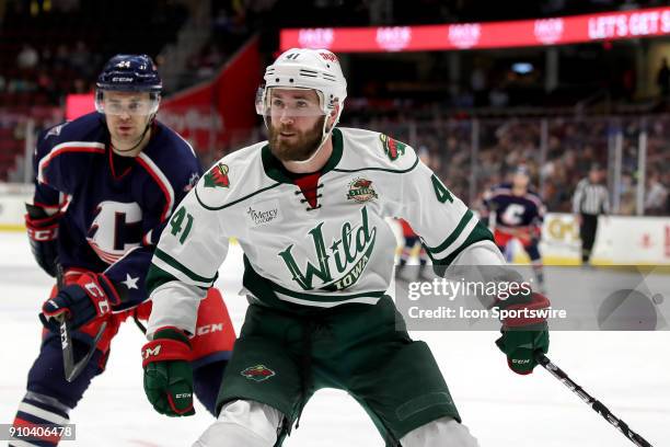 Iowa Wild center Landon Ferraro follows the puck into the corner during the first period of the American Hockey League game between the Iowa Wild and...