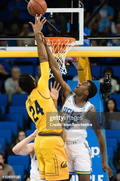 Bruins guard Kris Wilkes gets a hold of the arm of California Golden Bears forward Marcus Lee as he shoots a basket during the game between the...