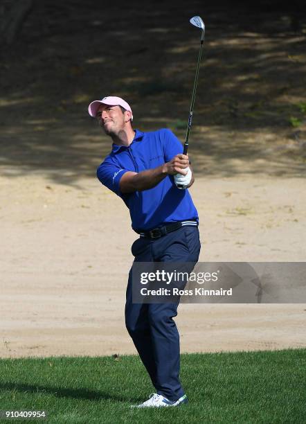 Jamie Elson of England hits his third shot on the 3rd hole during round two of the Omega Dubai Desert Classic at Emirates Golf Club on January 26,...