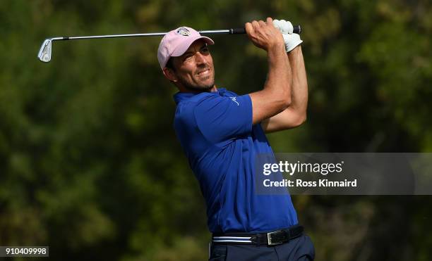 Jamie Elson of England hits his tee shot on the 4th hole during round two of the Omega Dubai Desert Classic at Emirates Golf Club on January 26, 2018...
