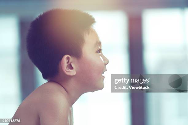 the cute little boy is taking a bath - running water bath stock pictures, royalty-free photos & images