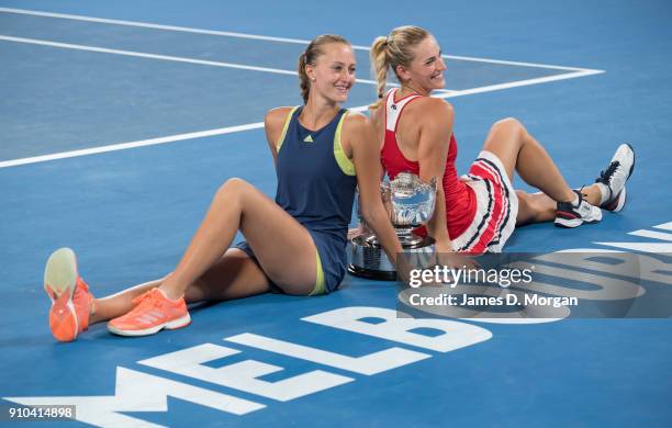 Winners of the Women's doubles Timea Babos of Hungary and ) Kristina Mladenovic of France with their trophy on day 12 of the 2018 Australian Open at...