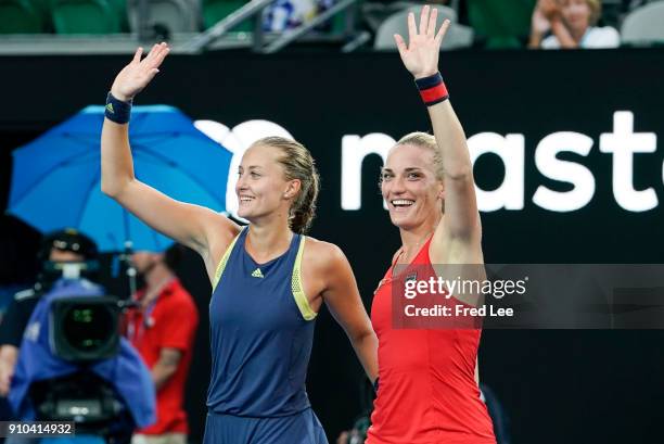 Hungary's Timea Babos and France's Kristina Mladenovic celebrate beating Russia's Ekaterina Makarova and Elena Vesnina in their women's doubles final...