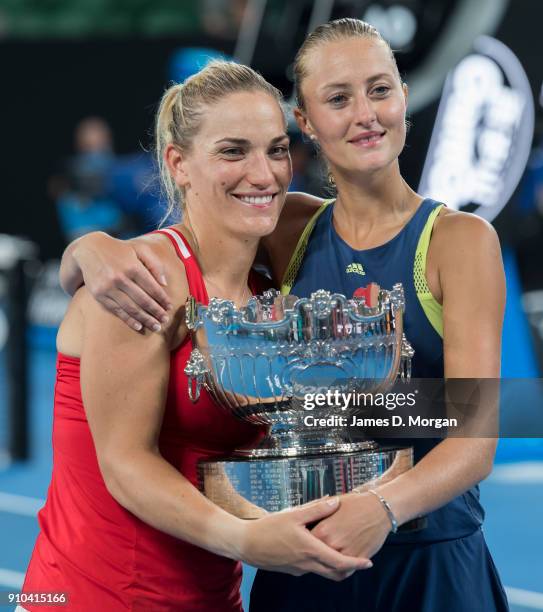 Winners of the Women's doubles Timea Babos of Hungary and Kristina Mladenovic of France with their trophy on day 12 of the 2018 Australian Open at...