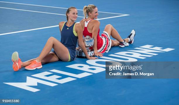 Winners of the Women's doubles Timea Babos of Hungary and ) Kristina Mladenovic of France with their trophy on day 12 of the 2018 Australian Open at...