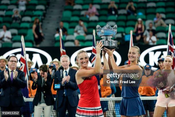 Kristina Mladenovic of France and Timea Babos of Hungary pose for a photo with the championship trophy after winning the women's doubles final...