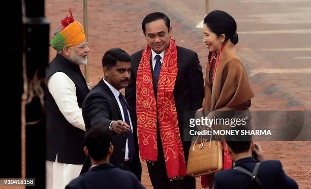 Thai Prime Minister Prayut Chan-o-cha meets Indian Prime Minister Narendra Modi as he arrives to attend India's 69th Republic Day Parade in New Delhi...