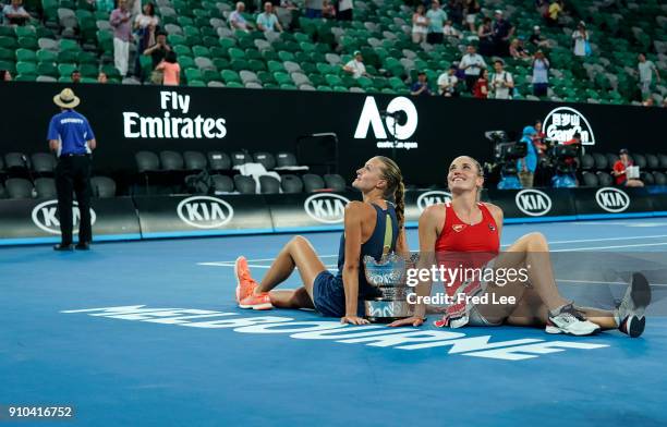 Kristina Mladenovic of France and Timea Babos of Hungary pose for a photo with the championship trophy after winning the women's doubles final...