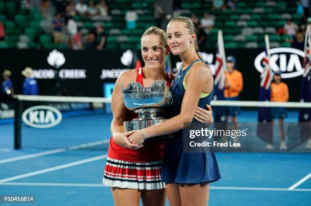 Kristina Mladenovic of France and Timea Babos of Hungary pose for a photo with the championship trophy after winning the women's doubles final...