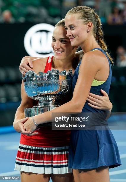 Kristina Mladenovic of France and Timea Babos of Hungary pose for a photo with the championship trophy after winning the women's doubles final...