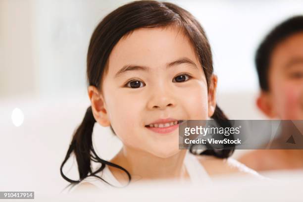 the lovely boy and girl are in the bathtub - sunken bath stock pictures, royalty-free photos & images