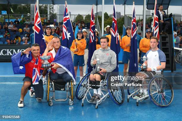 Stephane Houdet of France and Nicolas Peifer of France pose for a photo with the championship trophy and Alfie Hewitt of Great Britain and Gordon...