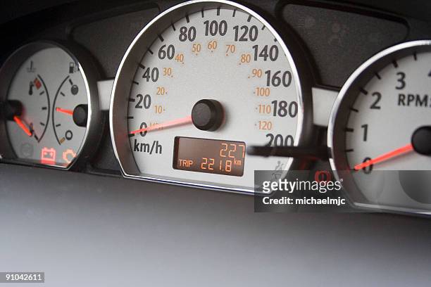 227km on new car odometer - kilometer stockfoto's en -beelden