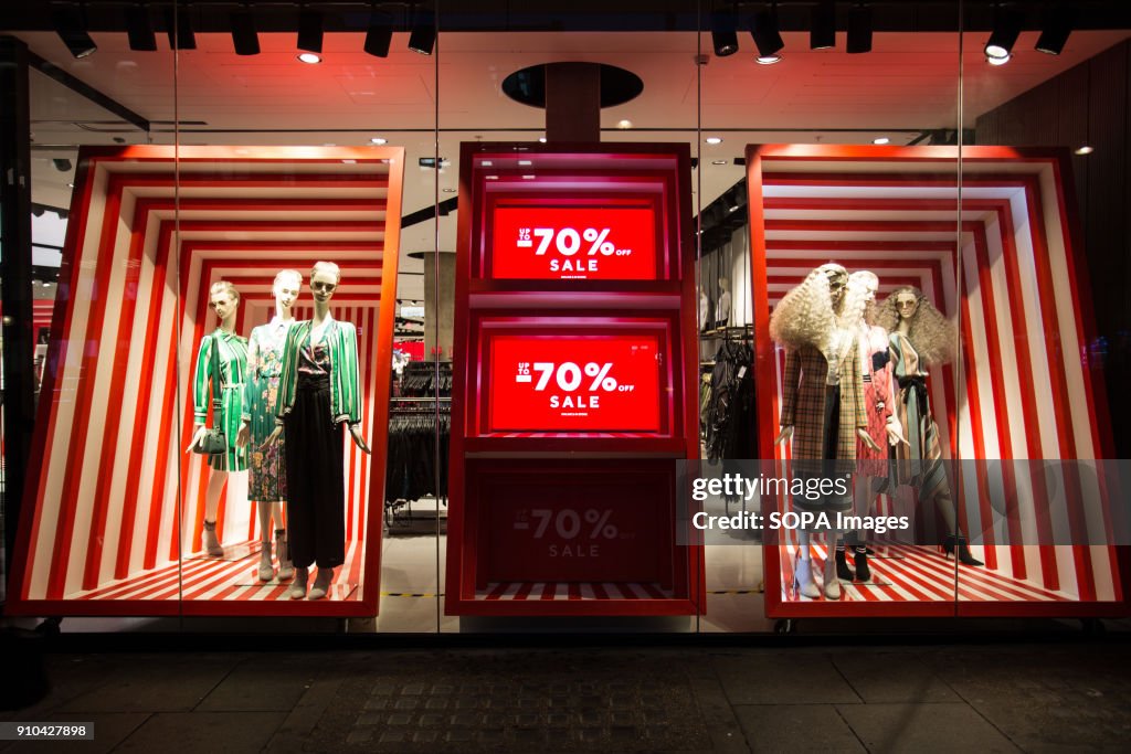 A 'sale' sign seen from a Oxford Street's clothes store in...