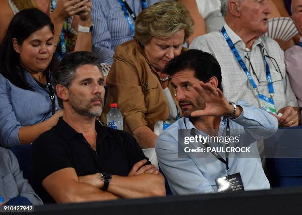 Former Australian Formula One driver Mark Webber talks to actor Eric Bana as they prepare to watch the men's singles semi-finals match between South...