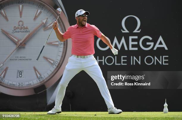 Matthew Southgate of England celebrates a hole in one on the 7th hole during round two of the Omega Dubai Desert Classic at Emirates Golf Club on...