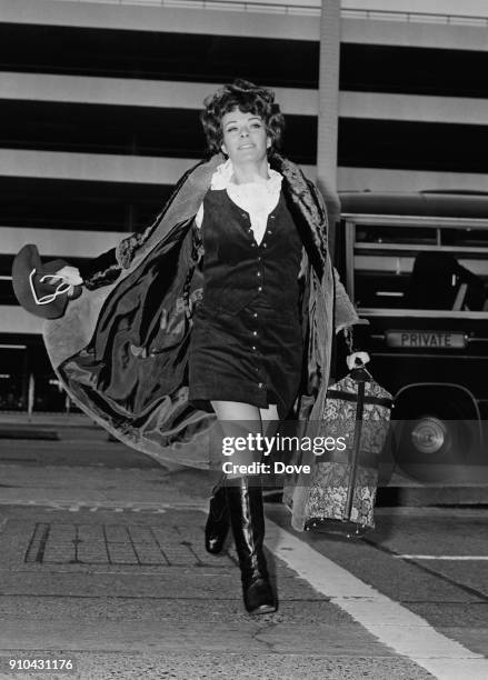 South African/British actress Janet Suzman arrives at Heathrow Airport to leave for the US, UK, 1st January 1968.