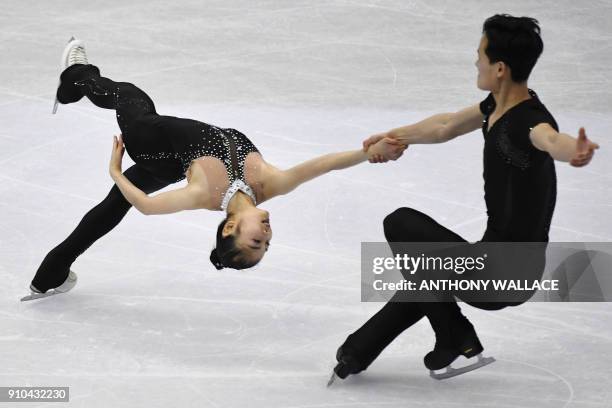 Ryom Tae-Ok and Kim Ju-Sik of North Korea perform during the pairs free skating program at the ISU Four Continents figure skating championships in...