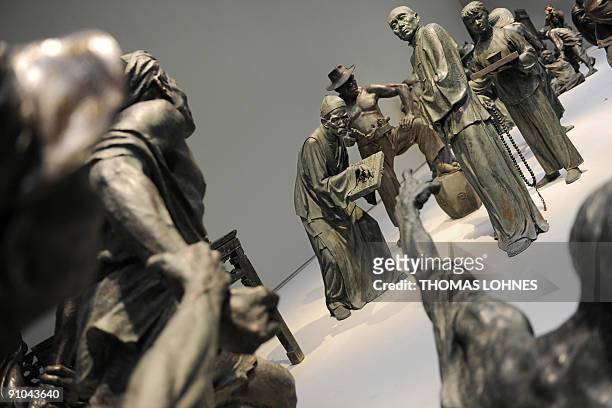 Sculptures of the exhibition "Art for millions - 100 sculptures from the Mao era" are prepared at the Schirm gallery in the central German city of...