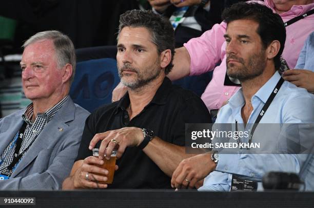 Australian actor Eric Bana and former Formula one driver Mark Webber watch Switzerland's Roger Federer play against South Korea's Chung Hyeon during...