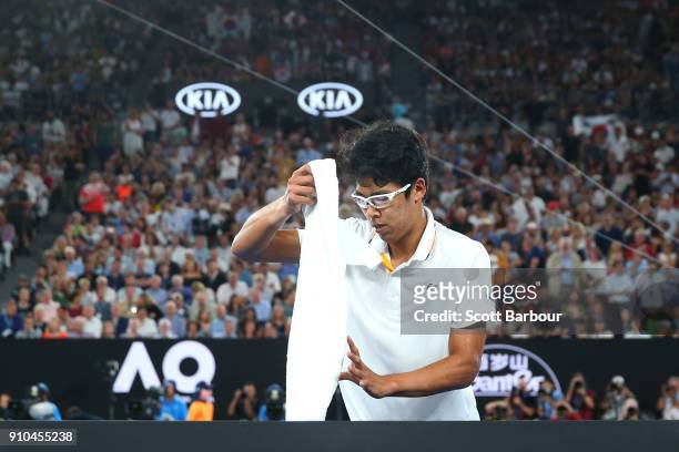 Dejected Hyeon Chung of South Korea walks off the court after retiring injured due to a blistered foot in his semi-final match against Roger Federer...