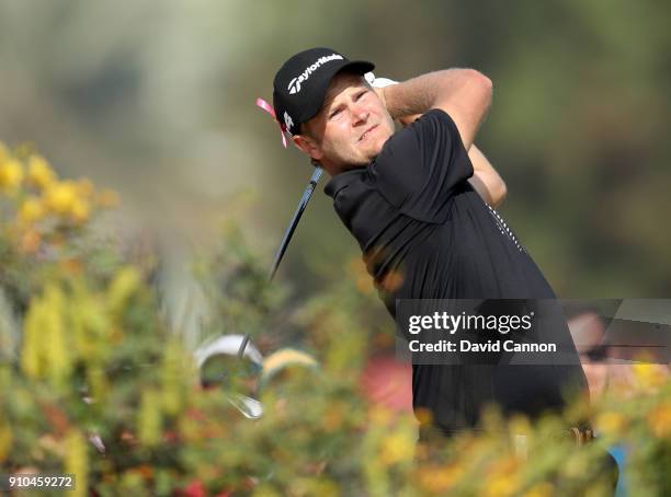 Henric Sturehed of Sweden plays his second shot on the par 5, 10th hole during the second round of the Omega Dubai Desert Classic on the Majlis...