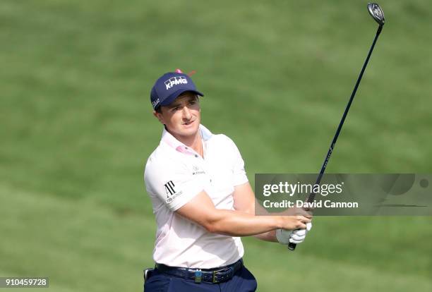 Paul Dunne of Ireland plays his second shot on the par 5, 10th hole during the second round of the Omega Dubai Desert Classic on the Majlis Course at...