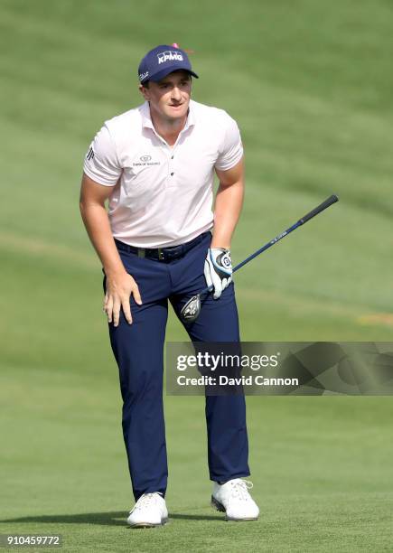 Paul Dunne of Ireland plays his second shot on the par 5, 10th hole during the second round of the Omega Dubai Desert Classic on the Majlis Course at...