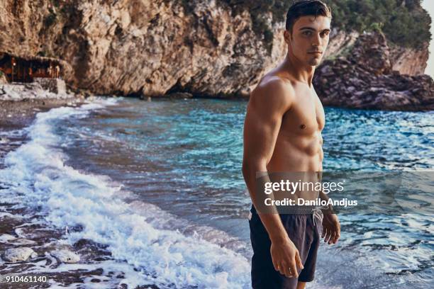 Beach Ripped 8,416 Muscular Man On Beach Stock Photos, High-Res Pictures, and Images ...