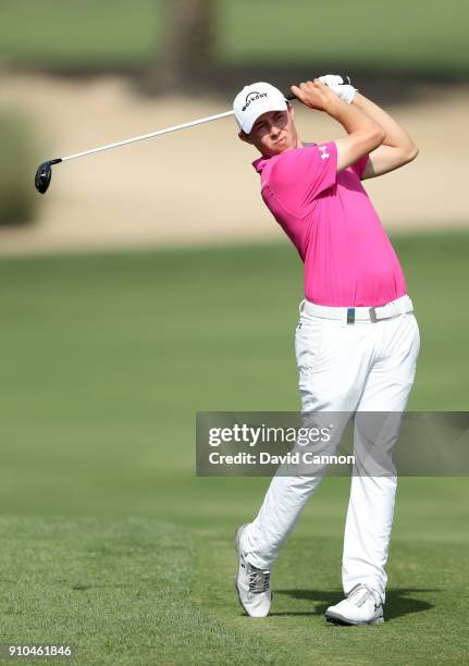 Matthew Fitzpatrick of England plays his second shot on the par 5, 10th hole during the second round of the Omega Dubai Desert Classic on the Majlis...