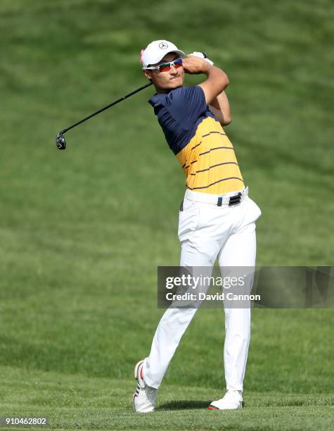 Haotong Li of China plays his second shot on the par 5, 10th hole during the second round of the Omega Dubai Desert Classic on the Majlis Course at...