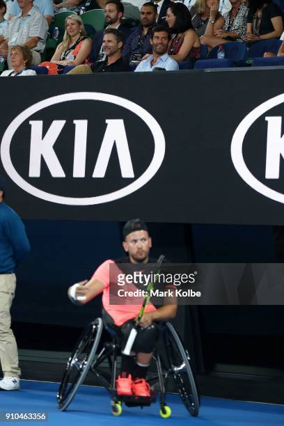 Actor Eric Bana and former Formula 1 driver Mark Webber watch the Quad Wheelchair Singles 3rd round match between Dylan Alcott of Australia and Heath...