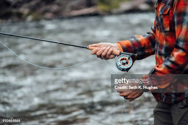 cropped view of man fishing - seth fisher stock pictures, royalty-free photos & images