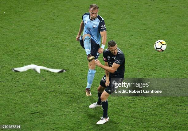 Jordy Buijs of Sydney FC gets the ball away from Jai Ingham of the Victory during the round 18 A-League match between Melbourne Victory and Sydney FC...