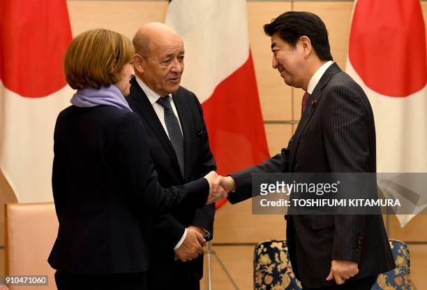 French Foreign Minister Jean-Yves Le Drian introduces French Defence Minister Florence Parly to Japanese Prime Minister Shinzo Abe at Abe's official...