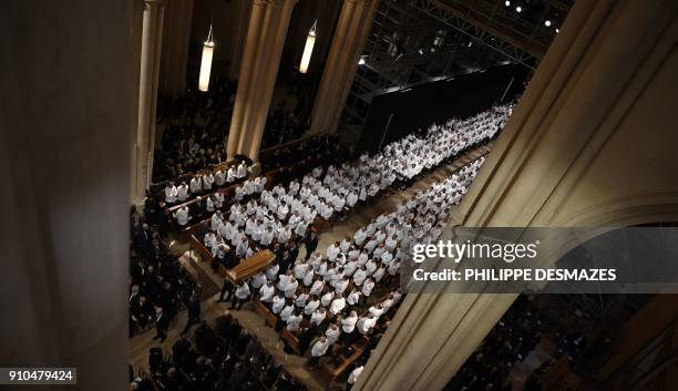 Pall bearers carry the coffin of French chef Paul Bocuse during a funeral ceremony at the Saint-Jean Cathedral in Lyon on January 26, 2018. More than...