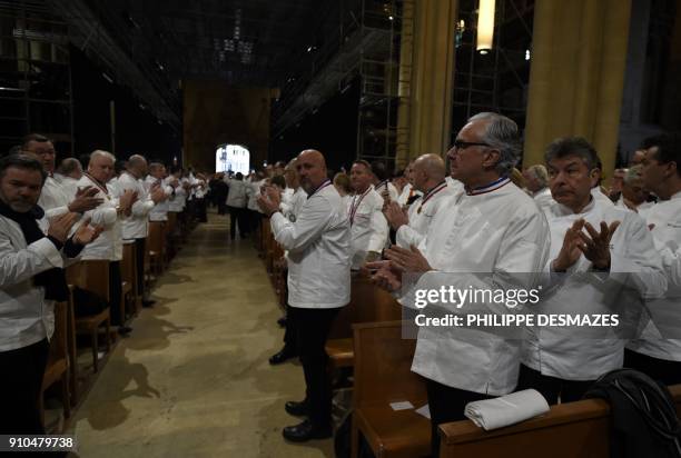 Chefs applud as the coffin of French chef Paul Bocuse leaves the Saint-Jean Cathedral in Lyon on January 26, 2018 during the funeral ceremony. More...