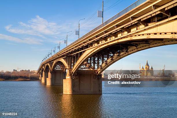 cathedral in arc of bridge - nizhny novgorod stock pictures, royalty-free photos & images