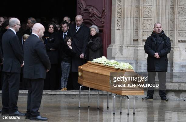 Son-in-law of late French chef Paul Bocuse Philippe Bernachon and French chef Paul Bocuse's widow Raymonde stand by the coffin of the late chef...