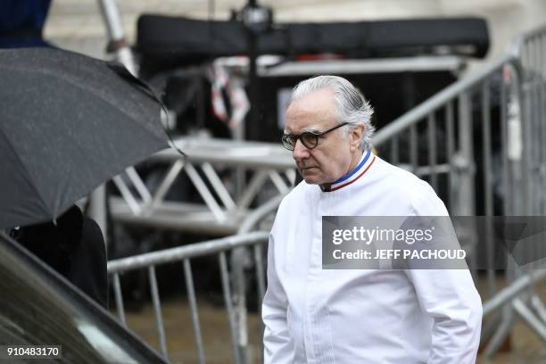 French chef Alain Ducasse leaves after attending the funeral ceremony for French chef Paul Bocuse at the Saint-Jean Cathedral in Lyon on January 26,...