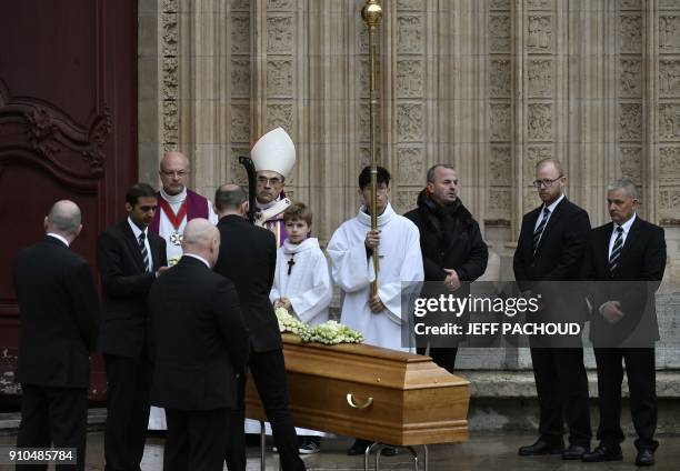 People gather around the coffin of French chef Paul Bocuse as it sits in front of the Saint-Jean Cathedral in Lyon at the end of the funeral ceremony...